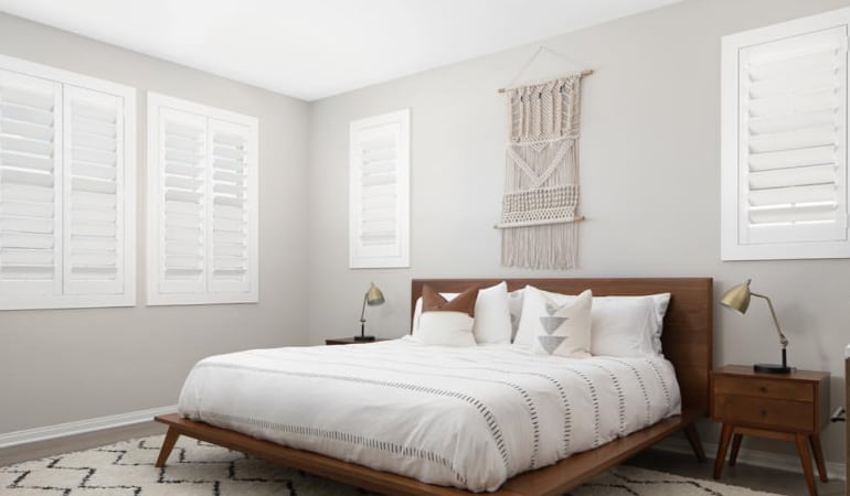 Polywood shutters in a bedroom.
